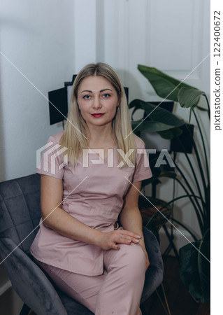 young woman master of laser hair removal, laser apart, woman smiles,Cosmetology section hair removal young woman master of laser hair removal, laser apart, woman smiles,Cosmetology section hair removal 122400672