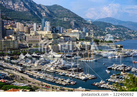 Monaco Monte Carlo buildings and port in summer, sea and mountains 122400692