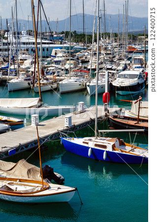 Port with boats in Antibes, summer day at the sea, white blue clouds Port with boats in Antibes, summer day at the sea, white blue clouds 122400715