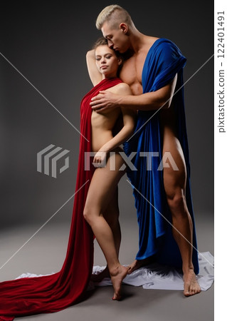 Couple embraces intimacy in artistic lingerie display during studio session Couple embraces intimacy in artistic lingerie display during studio session 122401491