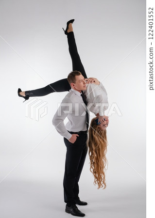 Couple performs an impressive dance lift showcasing athleticism and teamwork 122401552