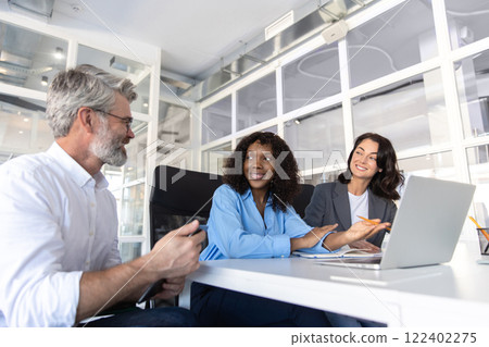 Group of business people working together as teamwork while sitting at office desk Group of business people working together as teamwork while sitting at office desk 122402275
