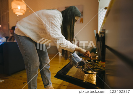 Cozy Home Cooking Engaging in Preparing a Truly Delicious Meal Right in the Kitchen Cozy Home Cooking Engaging in Preparing a Truly Delicious Meal Right in the Kitchen 122402827