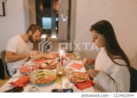 An Enchanting Romantic Dinner Setting Featuring Exquisite and Delicious Italian Cuisine 122402844