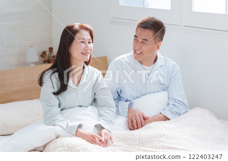 Senior couple in bed (waking up/sleeping) 122403247