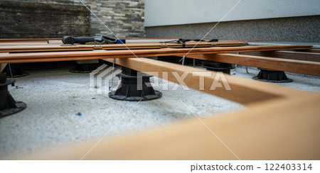 Low angle view of foundation construction for wooden patio Low angle view of foundation construction for wooden patio 122403314