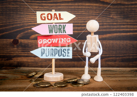 Perseverance Concept. Miniature road sign arrows on wood texture background 122403398