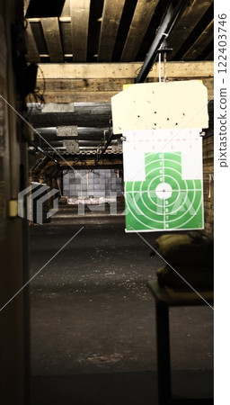 shooting range suspended green target view of a 50-meter underground range. Perfect for capturing the precision and thrill of shooting sports enthusiasts looking the depth intensity of target practice shooting range suspended green target view of a 50-meter underground range. Perfect for capturing the precision and thrill of shooting sports enthusiasts looking the depth intensity of target practice 122403746
