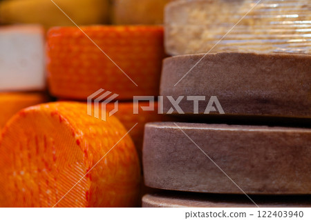 Stacked Wheels of Aged Cheese in Close-Up Stacked Wheels of Aged Cheese in Close-Up 122403940
