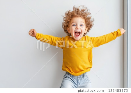 Young boy joyfully jumps after spotting favorite toy in store window 122405573