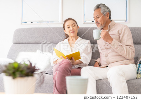 Senior couple reading a book Senior couple reading a book 122407152