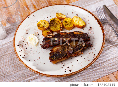Portion of just cooked churrasco with potatoes 122408345