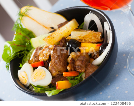 Salad with chicken hearts, fried cheese, quail eggs, pear, peach, wine 122408496
