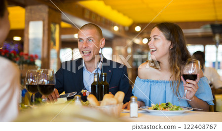 Group of men and women toasting at celebration 122408767