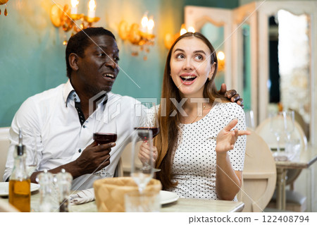 Girl telling story her lover at the restaurant 122408794