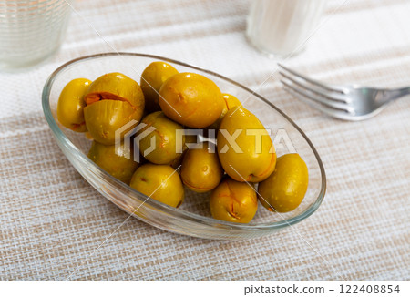 Pickled green olives with a stone 122408854