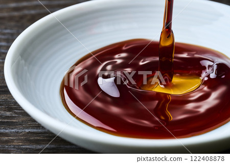 Soy sauce poured into a small dish 122408878