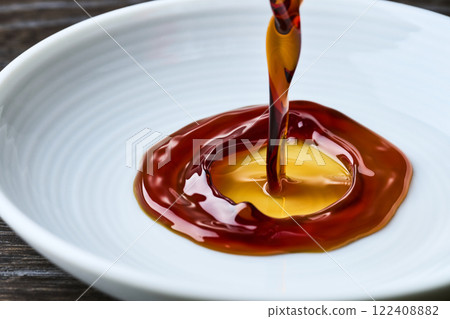 Soy sauce poured into a small dish 122408882