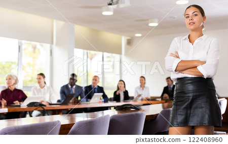 Ambitious smart millennial white brunette businesswoman posing 122408960