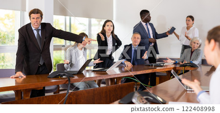 Group of business people arguing in meeting room Group of business people arguing in meeting room 122408998