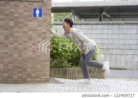 Man running to the toilet 122409717
