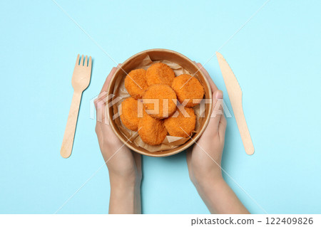 Fried mozzarella in a bowl on a blue background 122409826