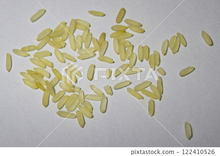 Yellow parboiled rice isolated in white bacground. 122410526