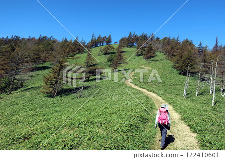A female climber heading to Mount Hachibuse from Mount Futatsuyama in Nagano A female climber heading to Mount Hachibuse from Mount Futatsuyama in Nagano 122410601