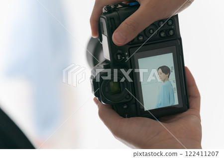 Male hands taking a picture with a digital camera 122411207