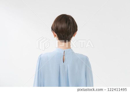 A middle-aged woman with short hair looking back 122411495