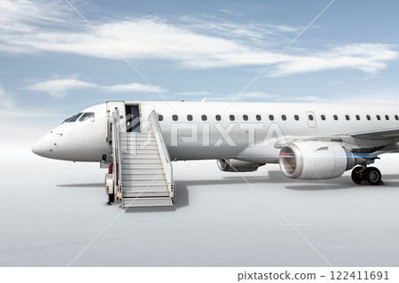 White passenger jet plane with boarding stairs isolated on bright background with sky 122411691