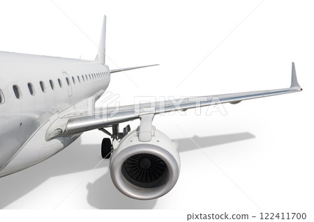 Passenger airliner isolated on white background. View of the wing and rear jet plane 122411700