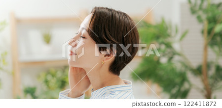 Beauty of a woman in her 30s wearing a shirt Beauty of a woman in her 30s wearing a shirt 122411872
