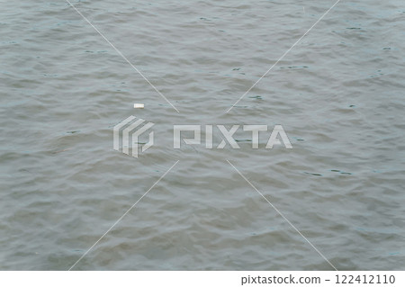 Styrofoam floating on the river 122412110