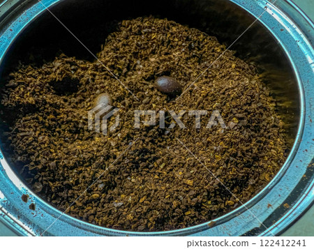 Coffee beans and ground coffee on a brown background. Coffee background. 122412241