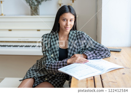 Woman with musical notes music literacy student or teacher Woman with musical notes music literacy student or teacher 122412584