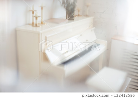 Piano music room with natural light with creative blur effect 122412586