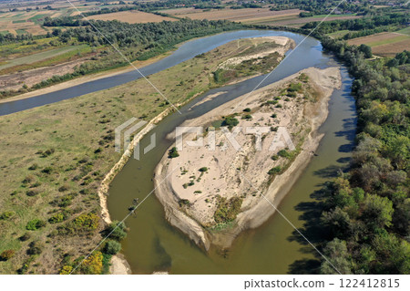 Aerial view of a huge sand riverbank island on a river 122412815
