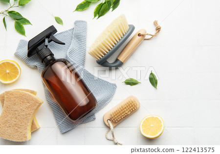 Eco friendly cleaning products promoting sustainable lifestyle with lemons and brushes 122413575