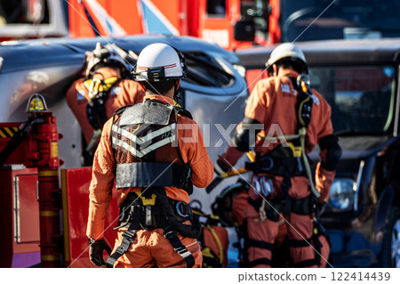 Rescue team members perform rescue training using a hydraulic cutter to cut off the roof of a car that has overturned in an accident during a fire drill at the New Year's ceremony. Rescue team members perform rescue training using a hydraulic cutter to cut off the roof of a car that has overturned in an accident during a fire drill at the New Year's ceremony. 122414439