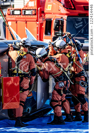 Rescue team members perform rescue training using a hydraulic cutter to cut off the roof of a car that has overturned in an accident during a fire drill at the New Year's ceremony. Rescue team members perform rescue training using a hydraulic cutter to cut off the roof of a car that has overturned in an accident during a fire drill at the New Year's ceremony. 122414446