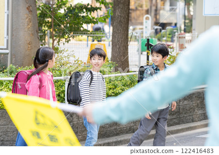 Elementary school students going to and from school Elementary school students going to and from school 122416483