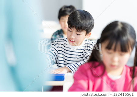 Elementary school students taking lessons in a classroom 122416561