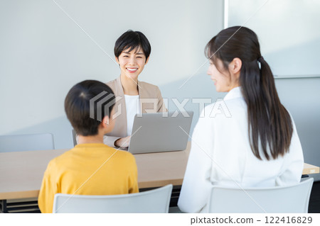 Parents and children having an interview with a teacher 122416829