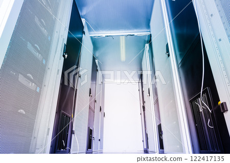 Server room with a row of server racks Server room with a row of server racks 122417135