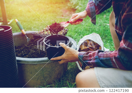 People gardening. Man planting gardens vegetables, Soil preparation agriculture gardener hobby plants at home and outdoor. plants in pots working. farm People gardening. Man planting gardens vegetables, Soil preparation agriculture gardener hobby plants at home and outdoor. plants in pots working. farm 122417190