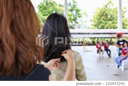 hairstyling, The back. The long hair of a young woman. purple hair highlights hairstyling, The back. The long hair of a young woman. purple hair highlights 122417241
