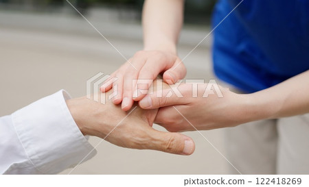 Caregiver's hands reaching out to the elderly Caregiver's hands reaching out to the elderly 122418269