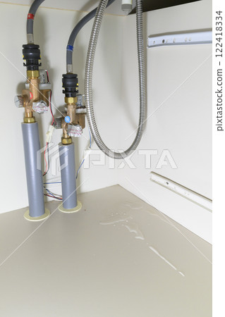Leaking faucet (actual view under the sink) 122418334