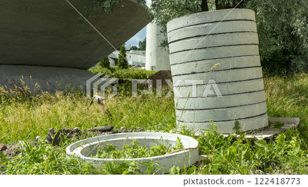 reinforced concrete sewer rings are stacked 122418773